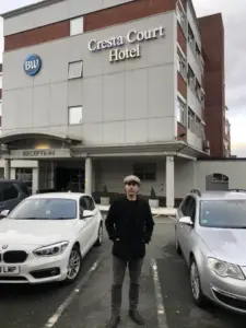 Image of Councillor Welton outside Crest Court Hotel, Altrincham